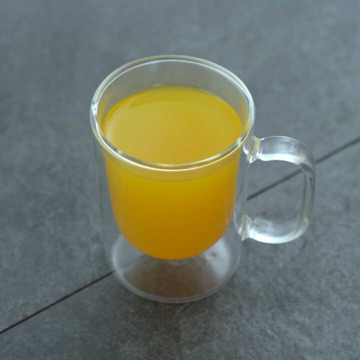 Healthy Homemade Turmeric Tea in a glass.