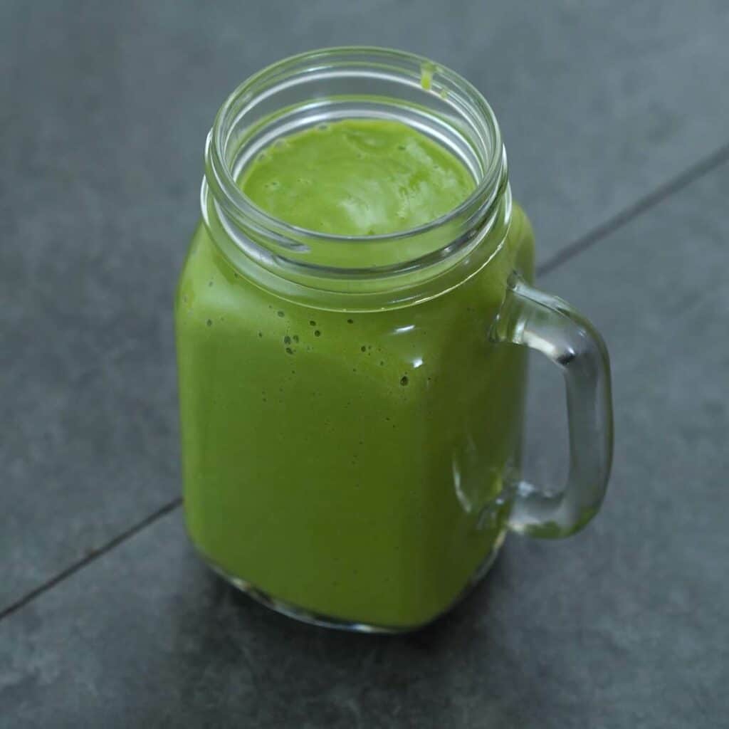 Healthy avocado smoothie in the serving mug.