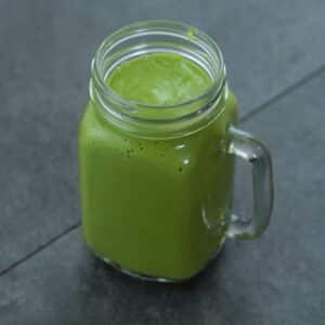 Healthy avocado smoothie in the serving mug.