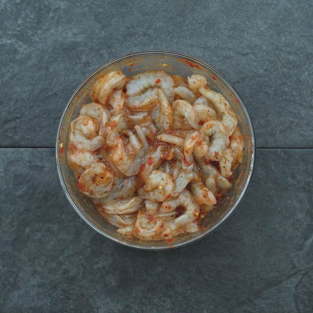 shrimp mixed in a spicy seasoning marinade
