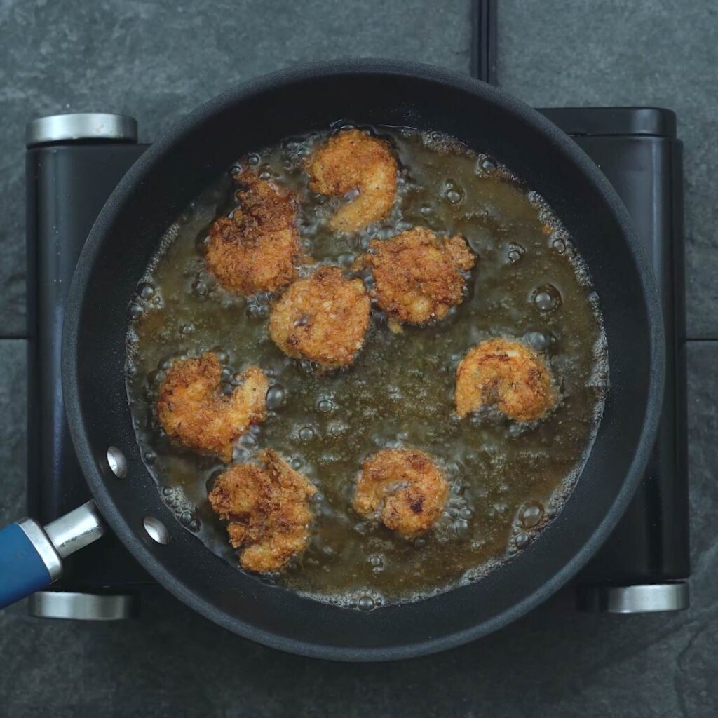 golden breaded shrimp in oil