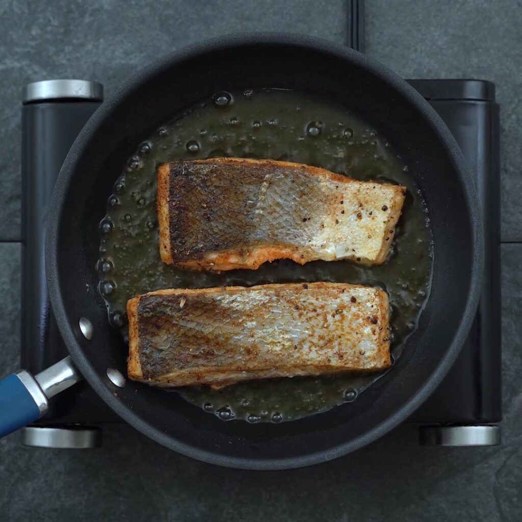 Salmon is frying in oil