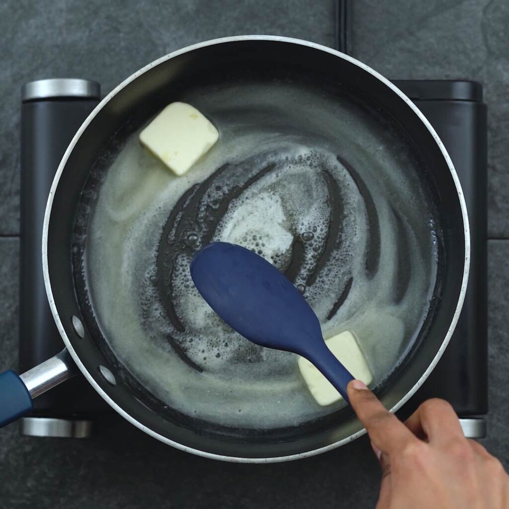 spreading the butter to melt in a pan