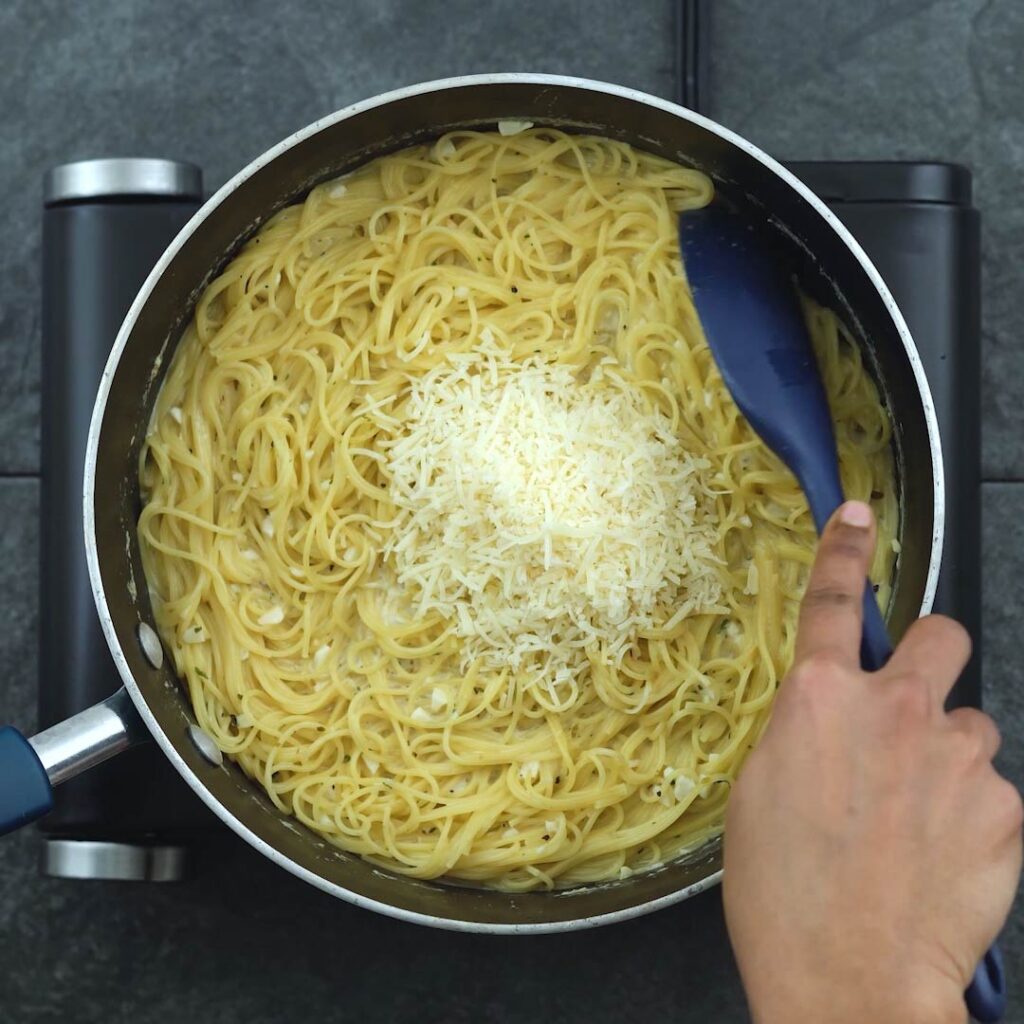 Grated Parmesan Cheese added to pasta