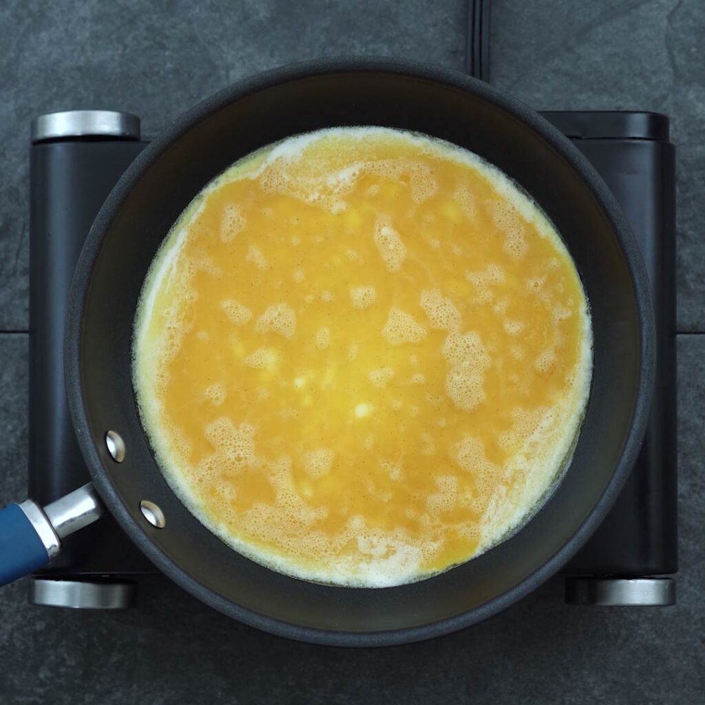 Egg is cooking in a pan