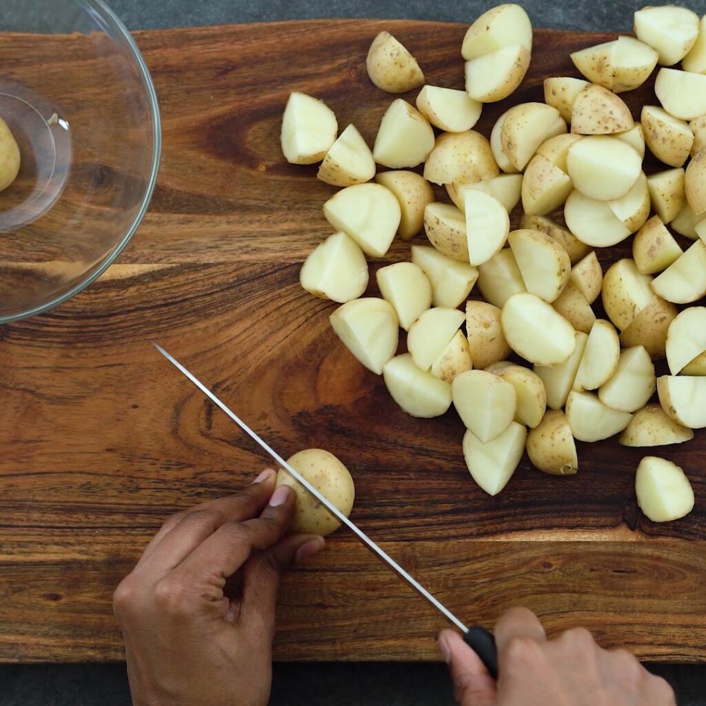 Chopping potatoes into small pieces