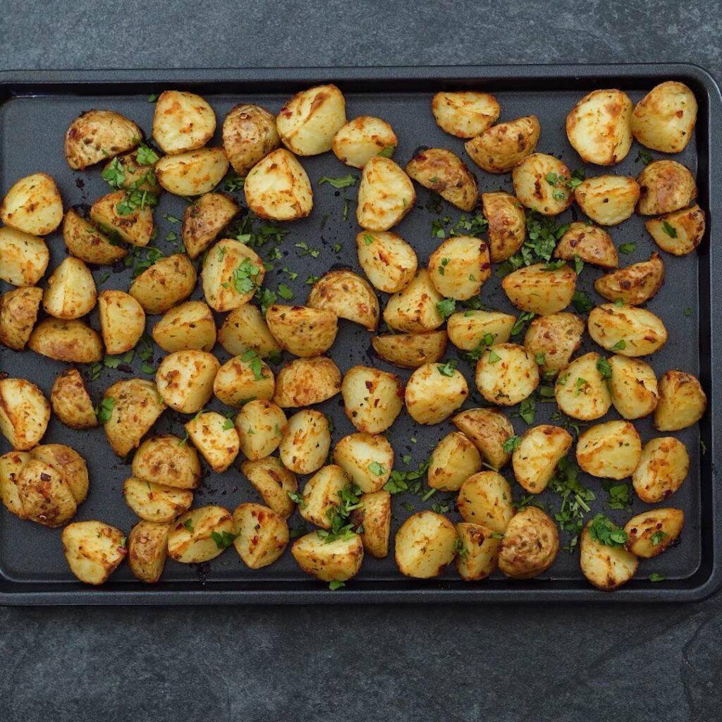 Roasted Potatoes garnished with cilantro leaves