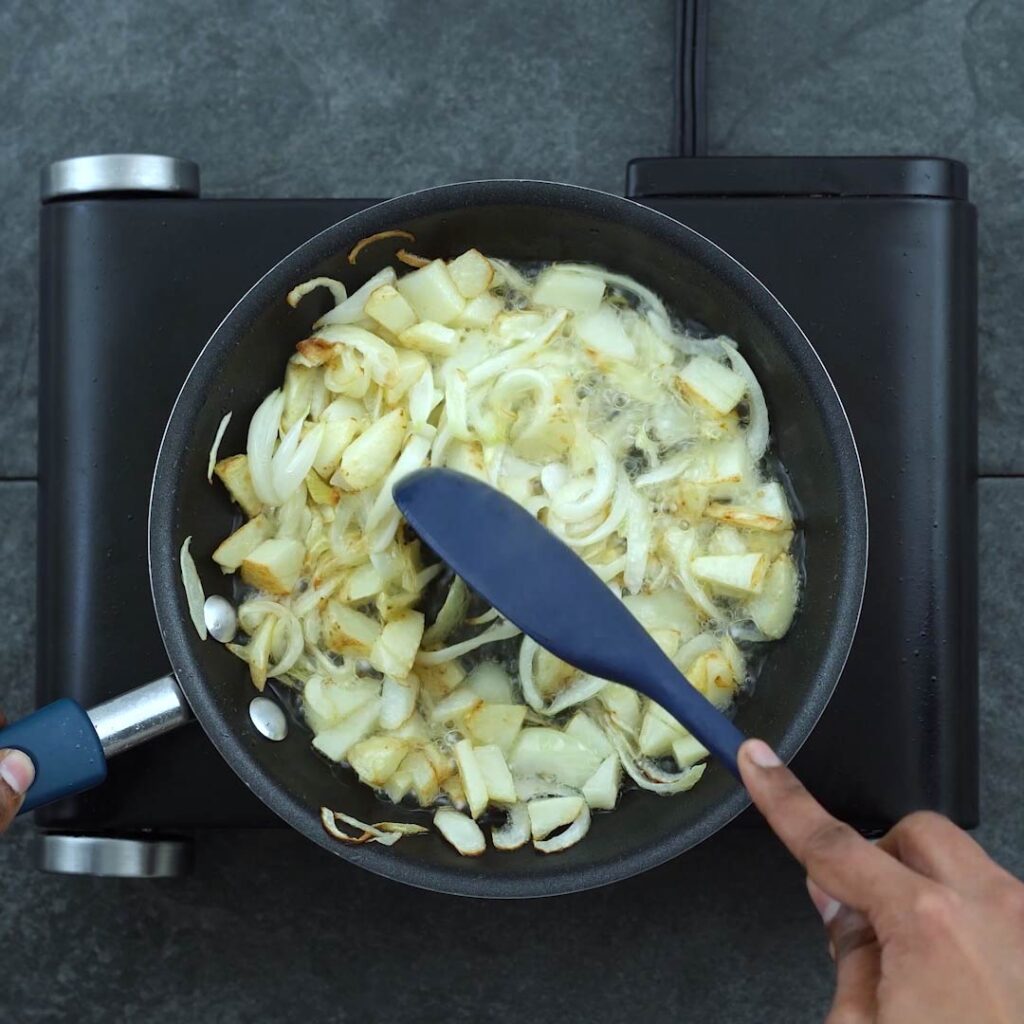 crispy onion and potatoes in a pan