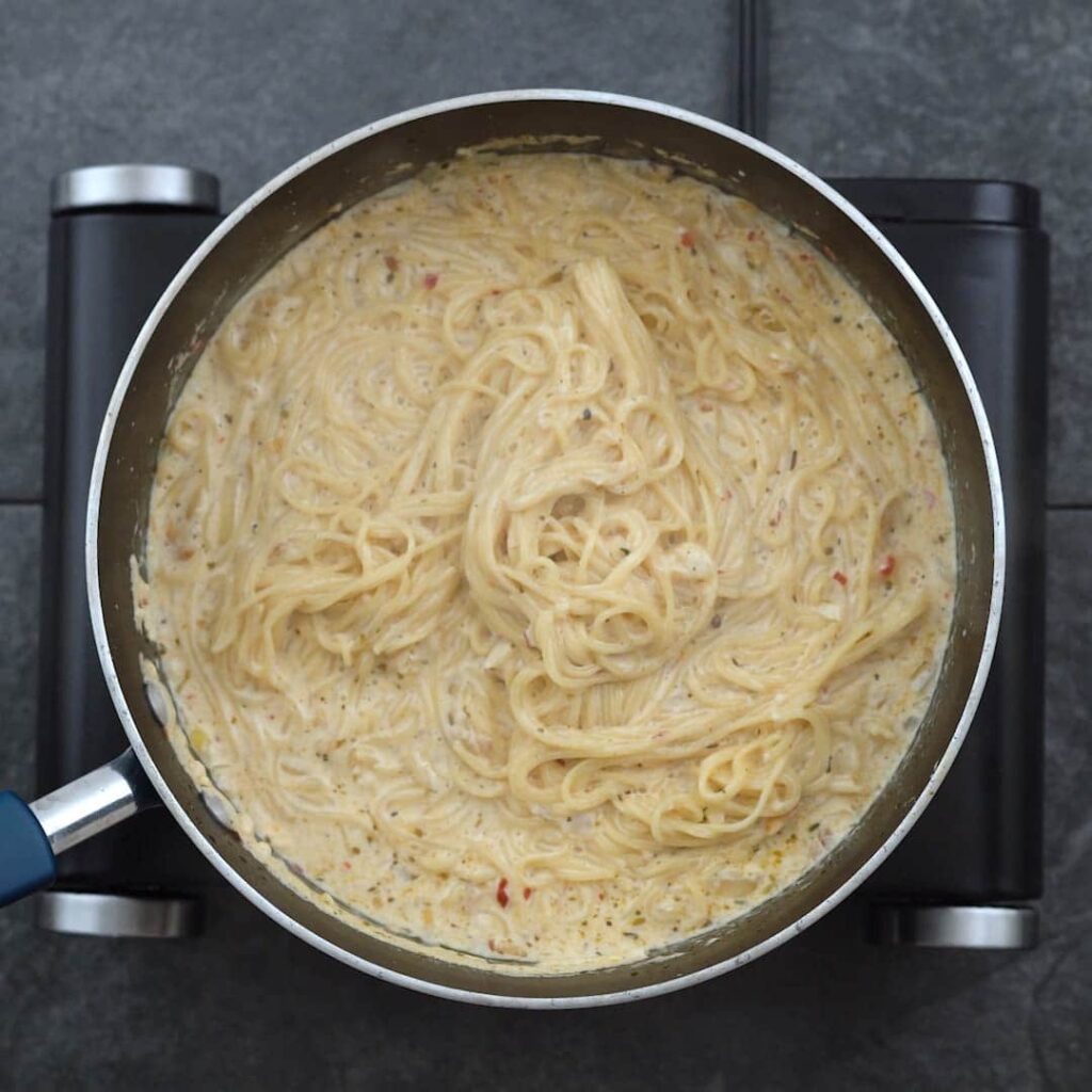 Cooked creamy pasta in a pot