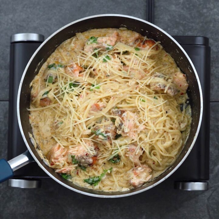 Salmon Pasta garnished with parmesan cheese