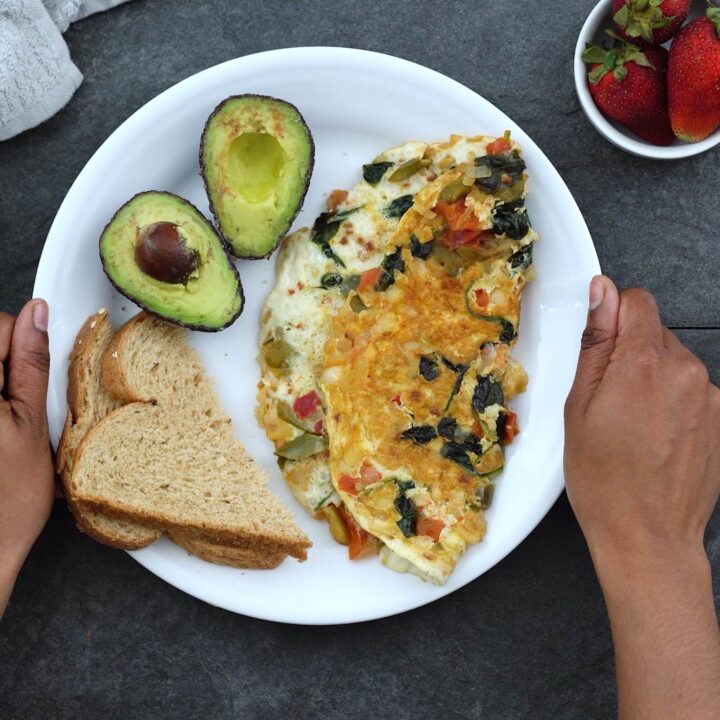 Serving healthy Egg White Omelet with bread and avocado