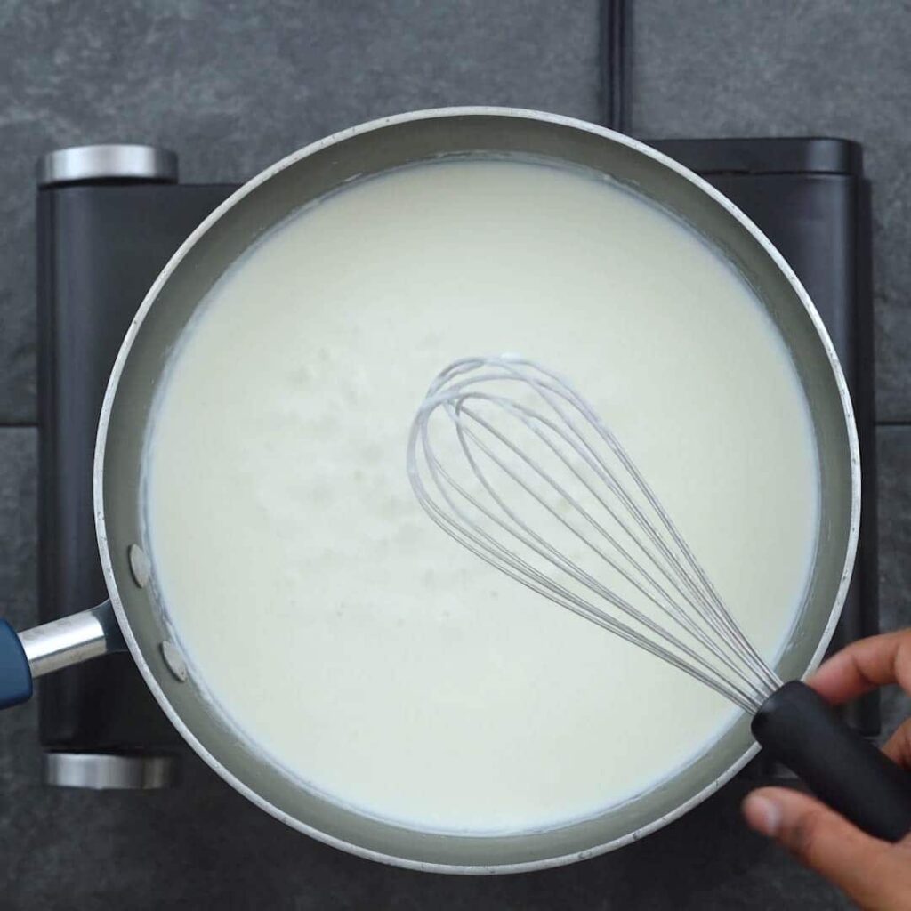 Stirring milk in flour mixture