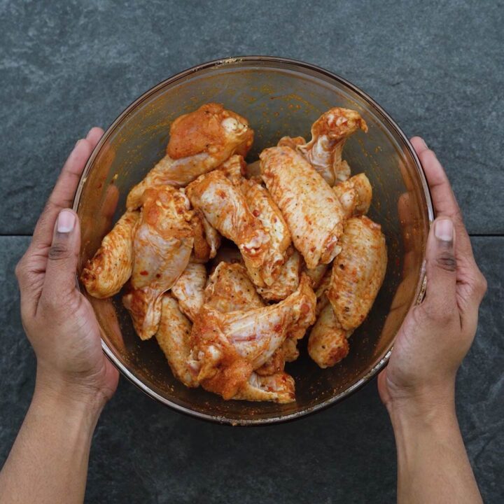 Seasoned chicken wings in a bowl