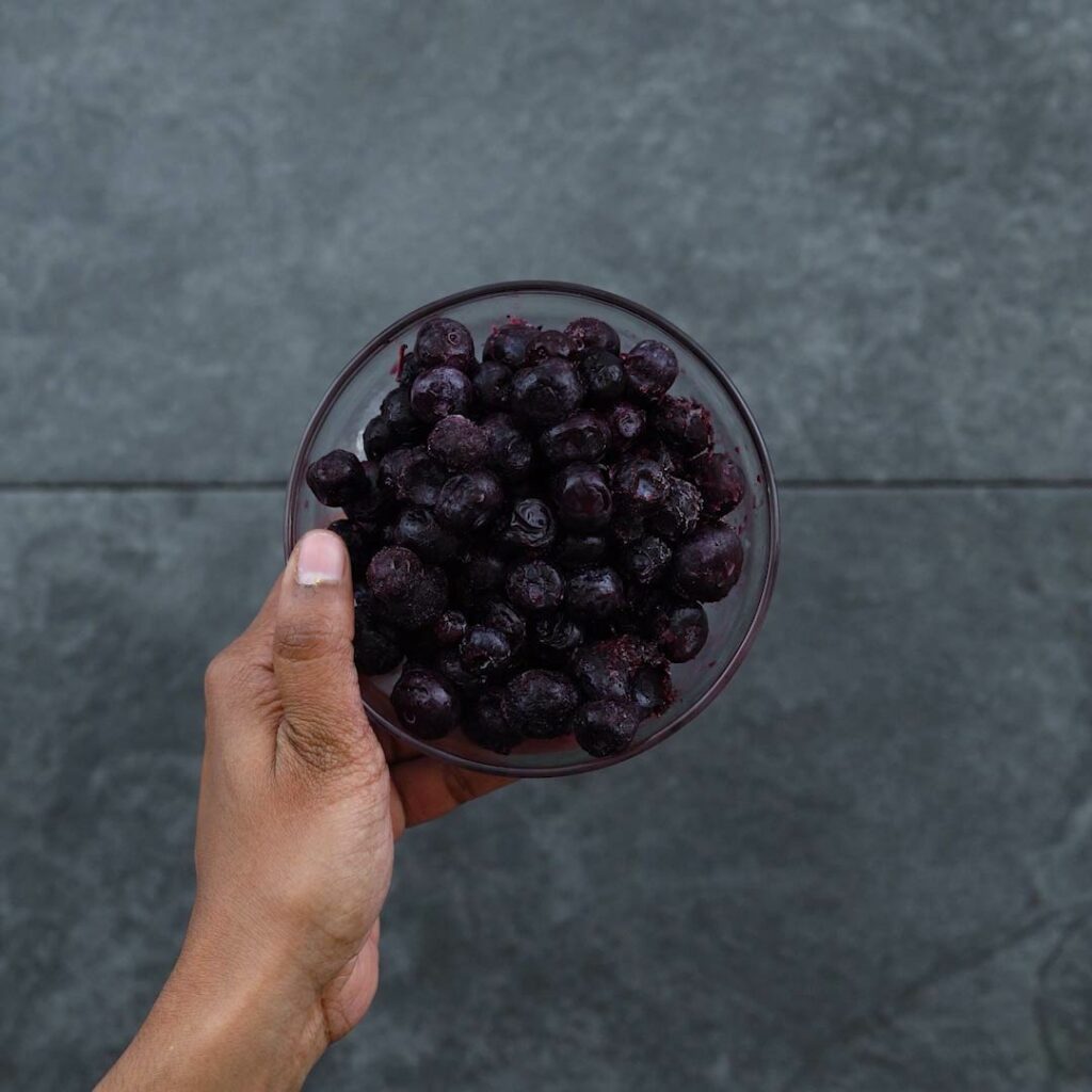 Frozen blueberries in a bowl.