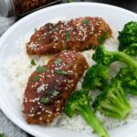 Honey Garlic Chicken Breast in a white plate with rice and broccoli