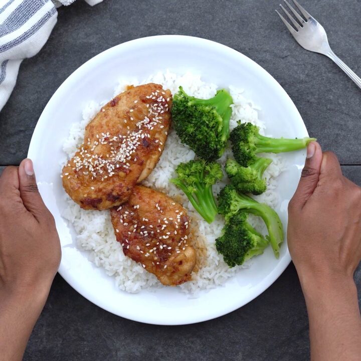 Serving honey garlic chicken over rice and broccoli