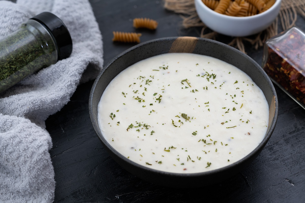 Creamy Bechamel or White Sauce in a bowl on a table 