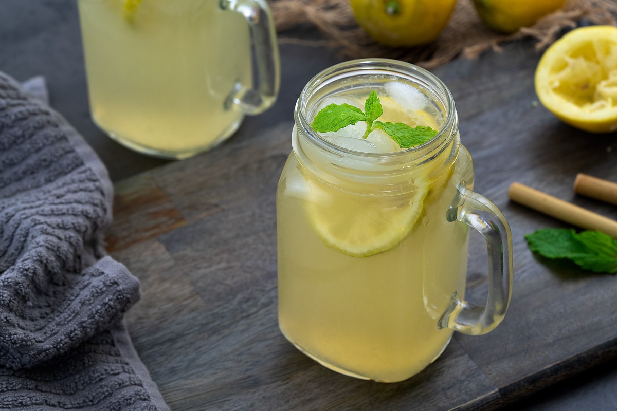 Homemade Lemonade in a serving glass mug.