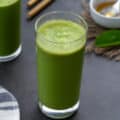 Fresh Spinach Smoothie in a serving glass placed on a table.