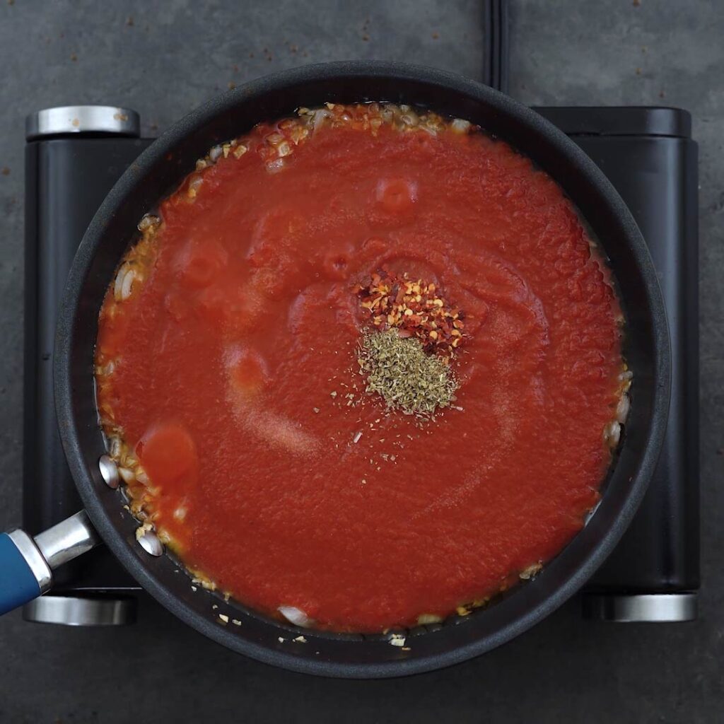 Tomato Sauce with seasoning in a pan