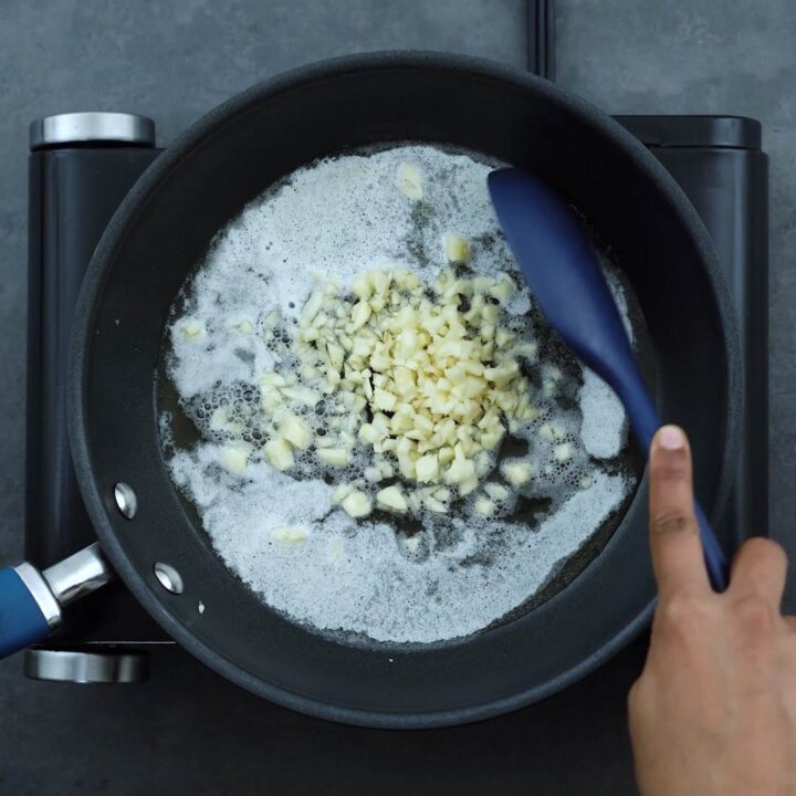 Sauteing the garlic in a pan