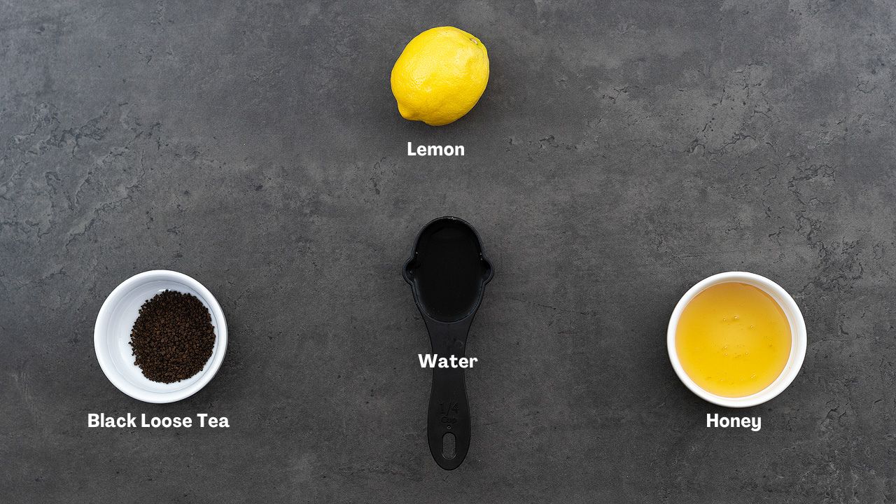 Honey Lemon Tea ingredients placed on a grey table.