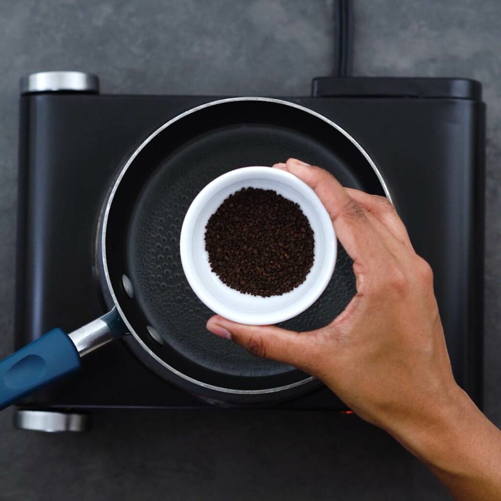 Adding black loose tea.