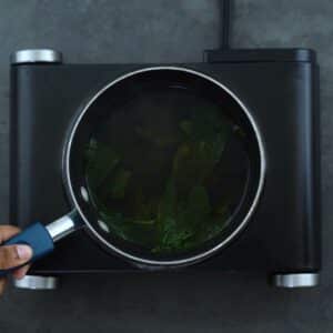 Green Mint Tea in a saucepan.