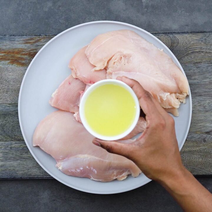Adding olive oil to chicken breast