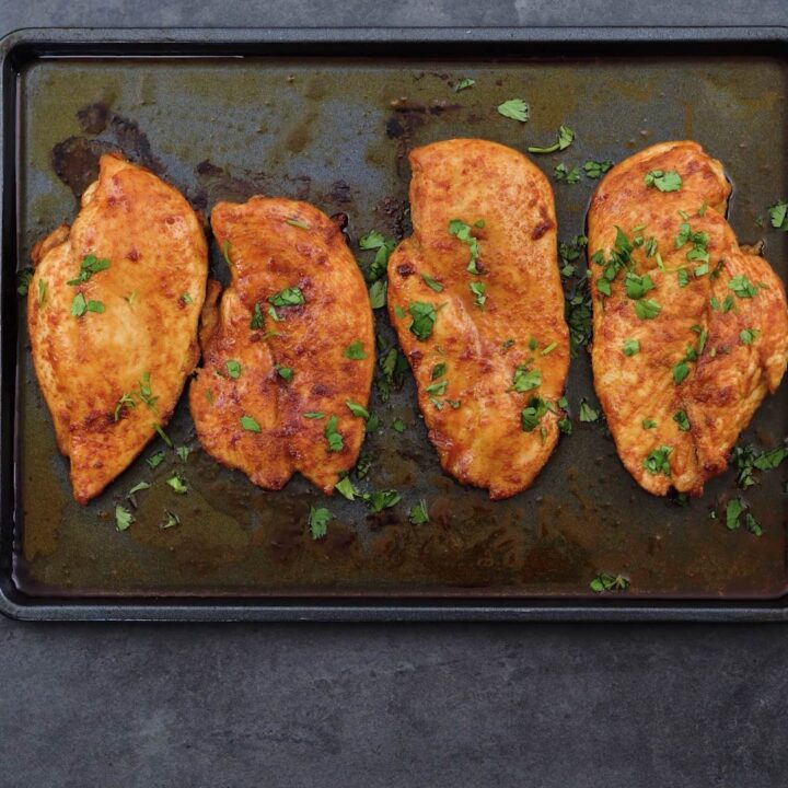 Perfectly Baked Chicken breasts garnished with coriander leaves