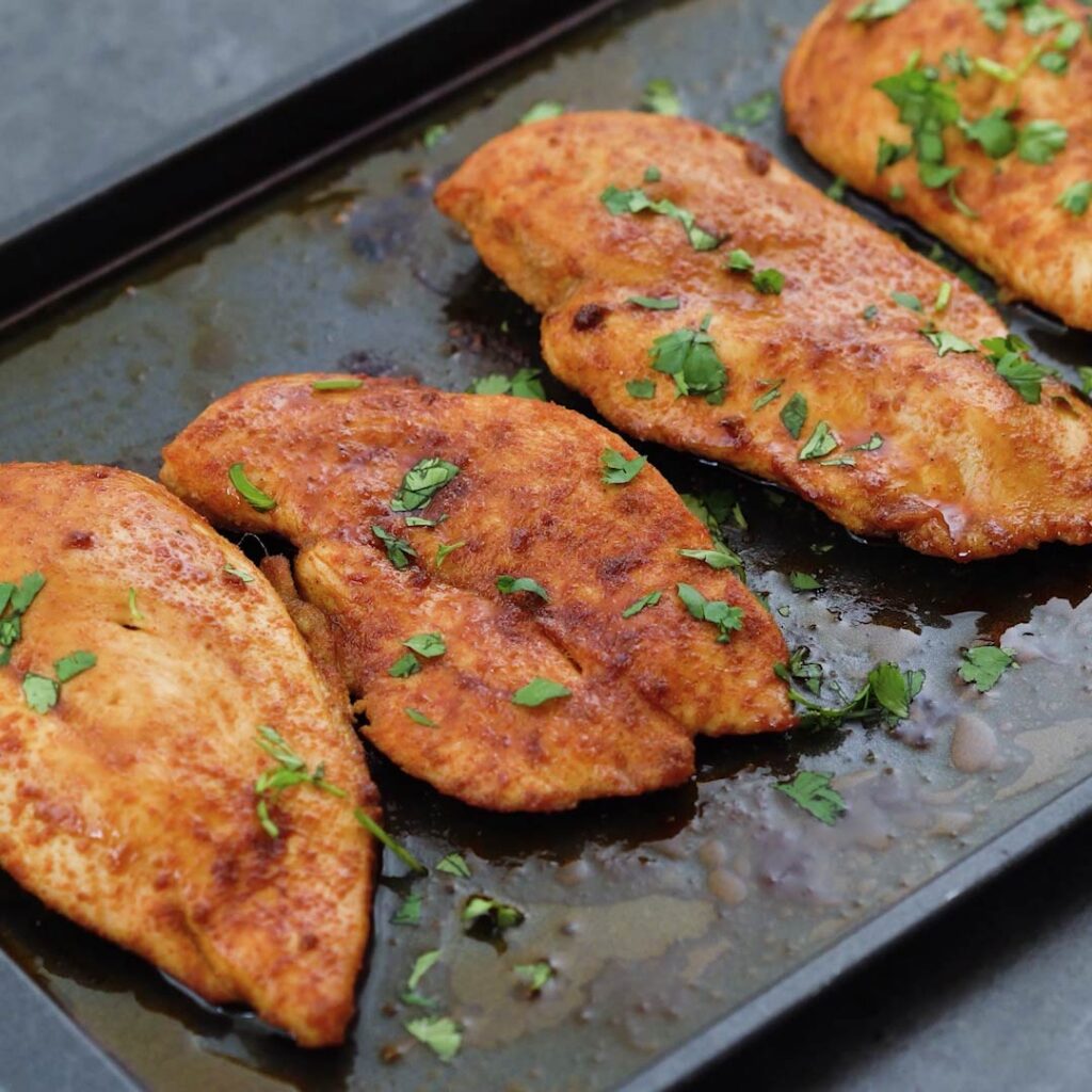 Baked Chicken Breast garnished with coriander leaves