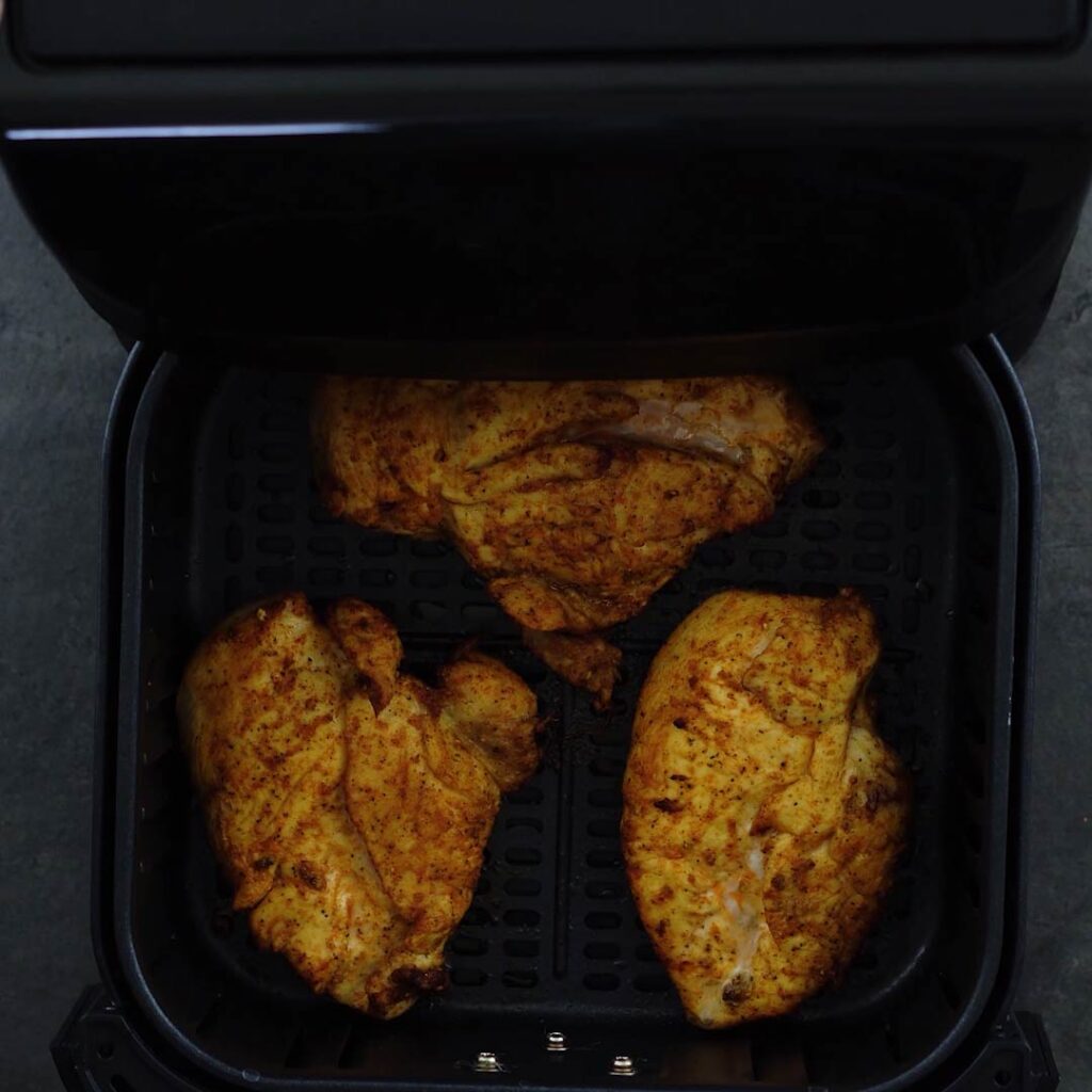 Perfectly air fried chicken breast in the basket