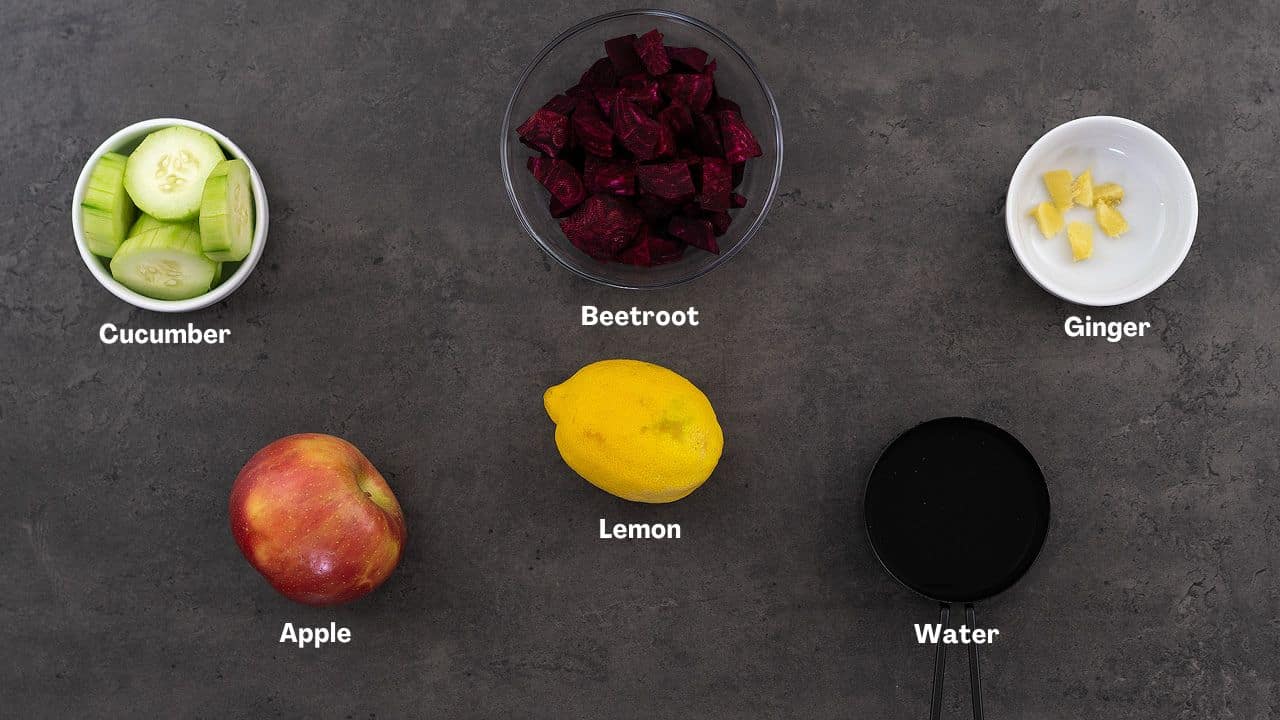 Beetroot juice recipe ingredients placed on a grey table.