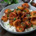 Honey Garlic Shrimp in a white bowl placed on a grey table