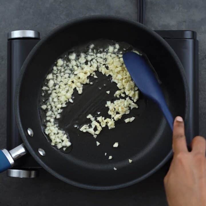 Sauteing garlics in a pan