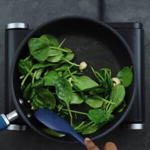 Sauteing spinach in the pan