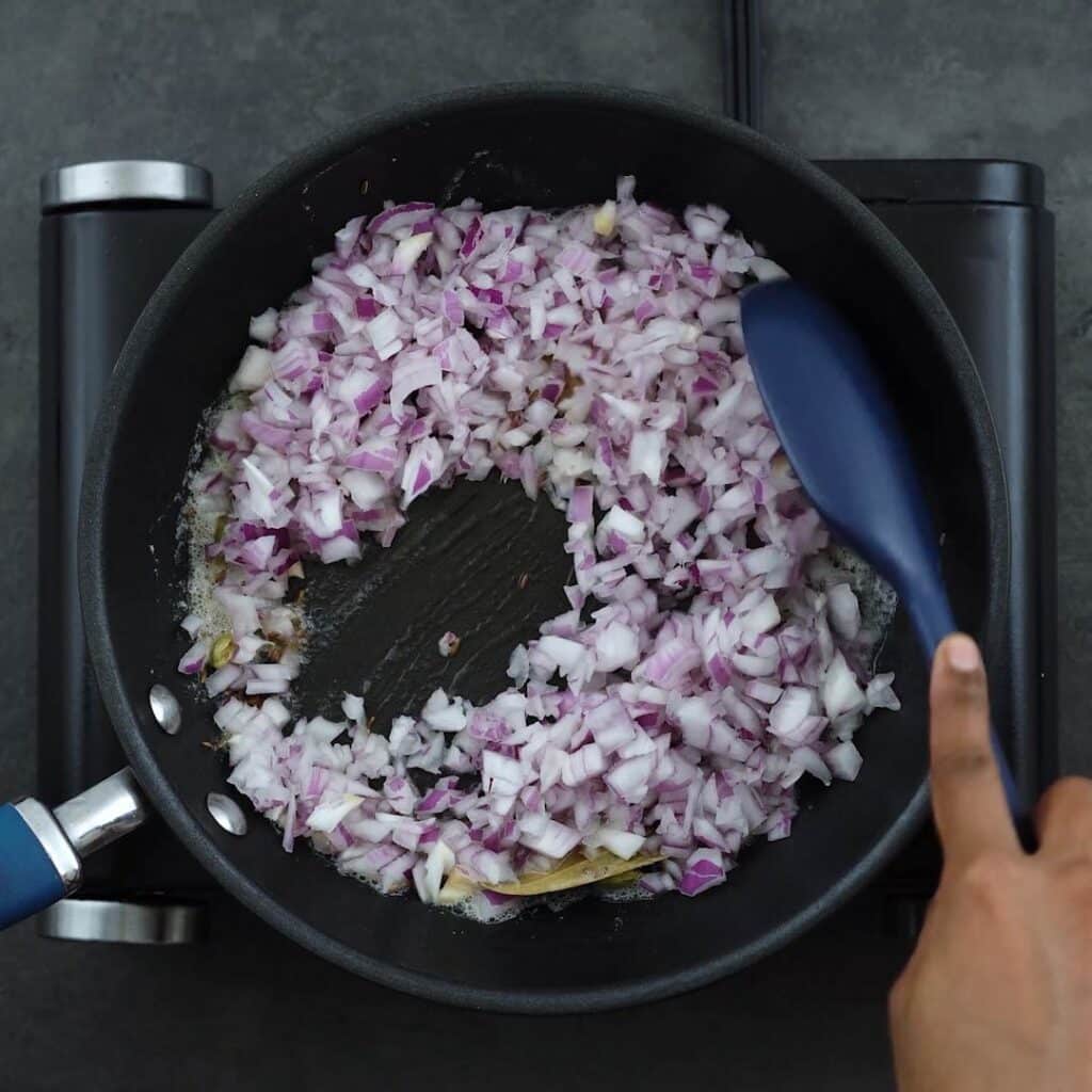 Sauteing the onion in the pan