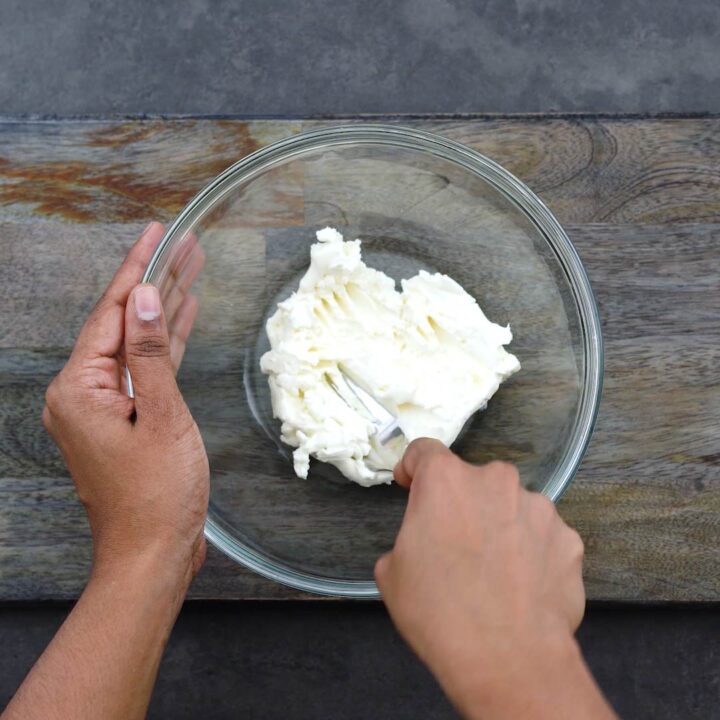 Softening the cream cheese with fork