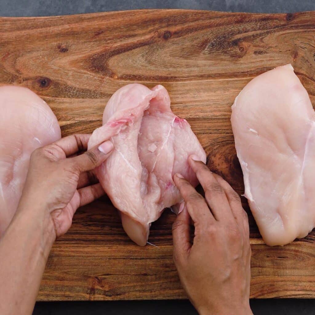 Silt chicken breast on a cutting board