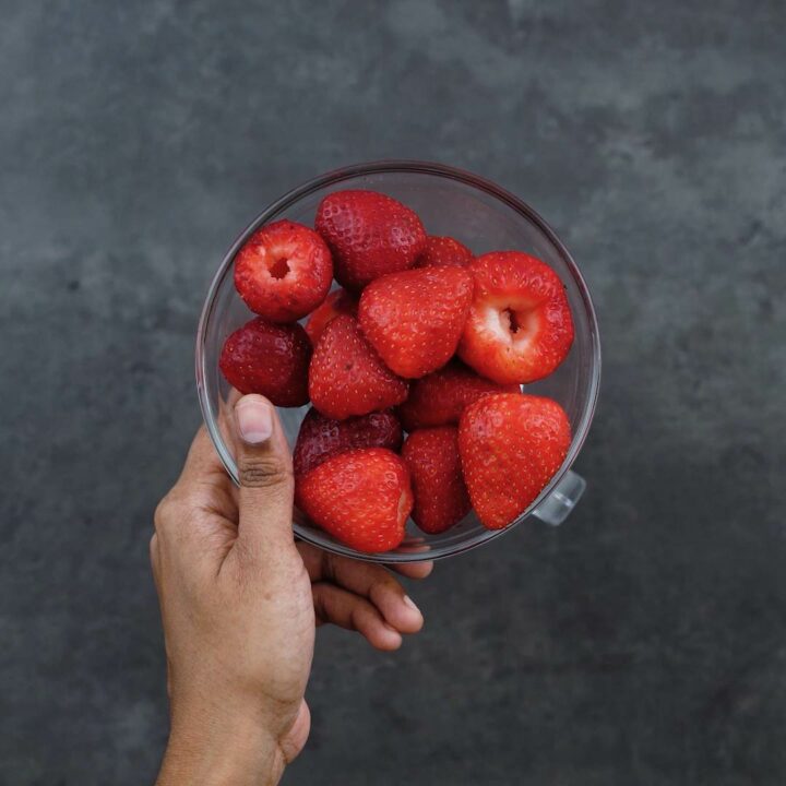 Strawberries in a glass bowl.