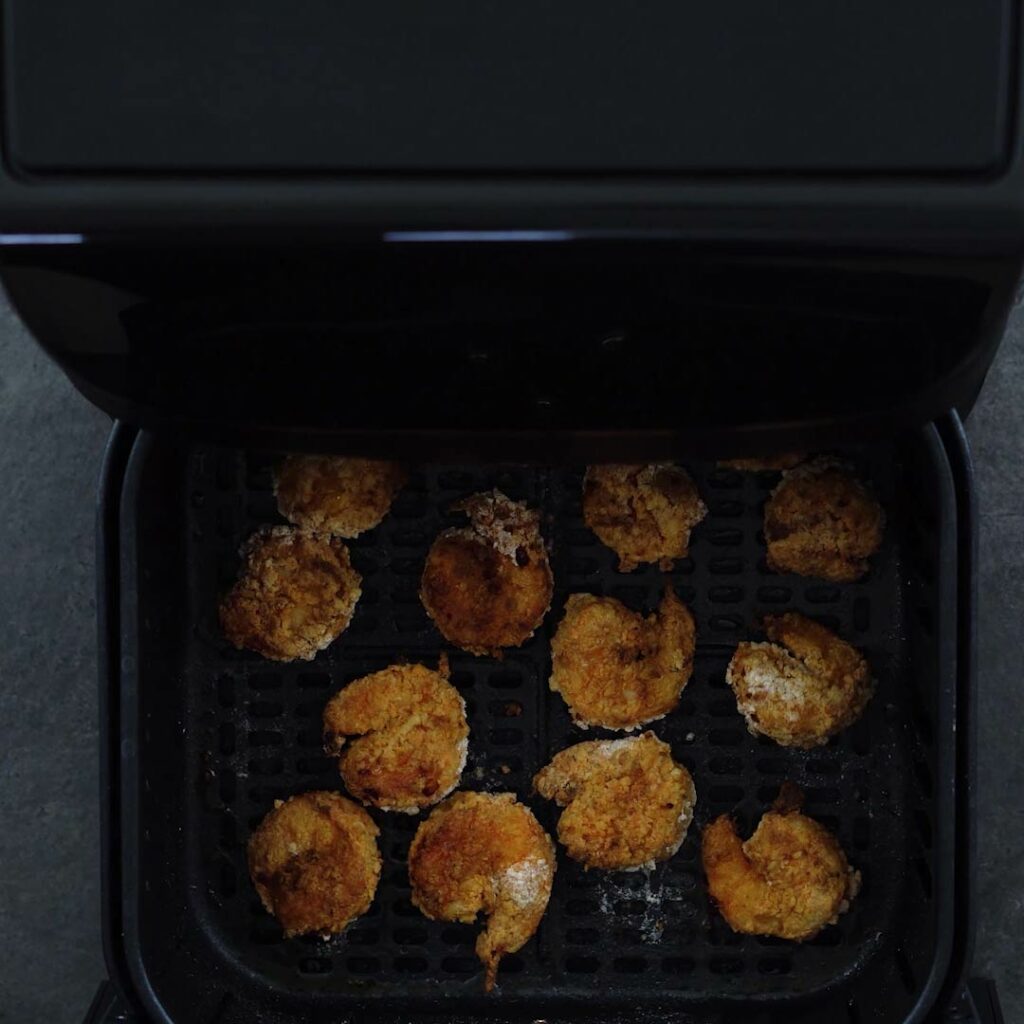 Perfectly Air Fried Shrimp in the air fryer basket
