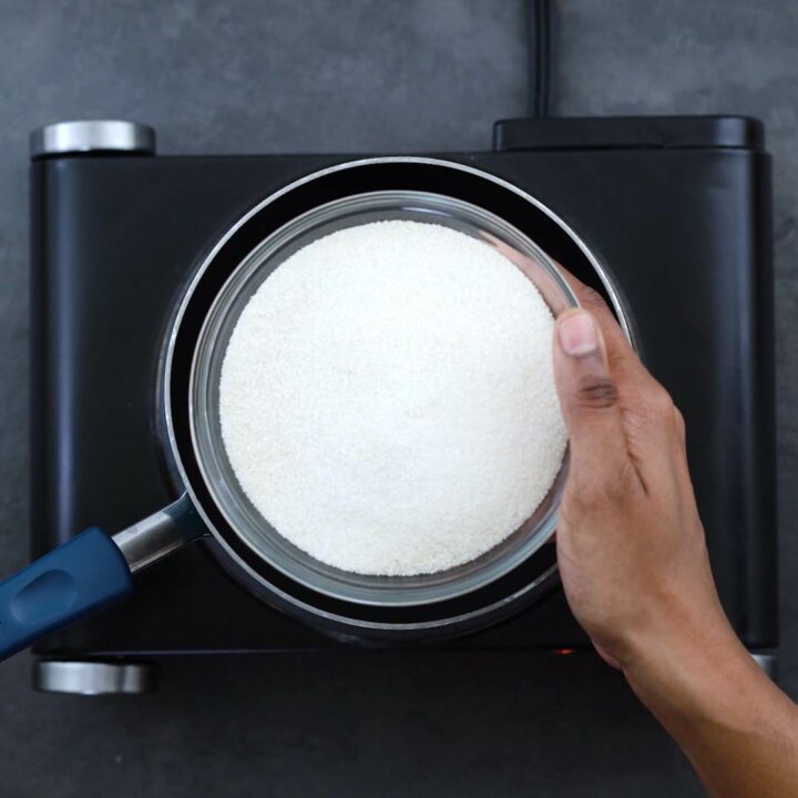 Adding a bowl of sugar into the saucepan.