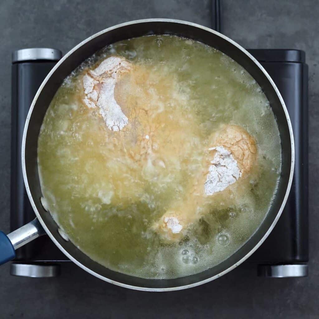 Chicken frying in a hot oil