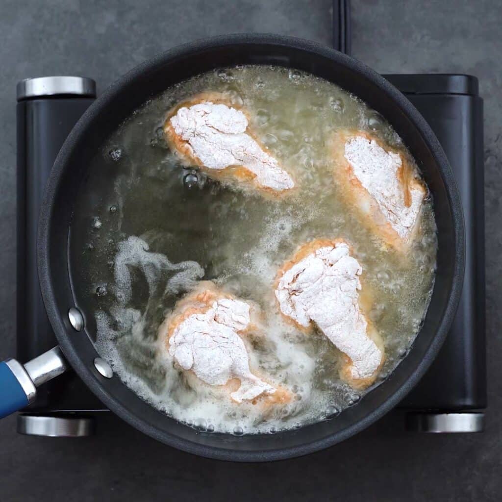 Chicken Wings frying in oil.