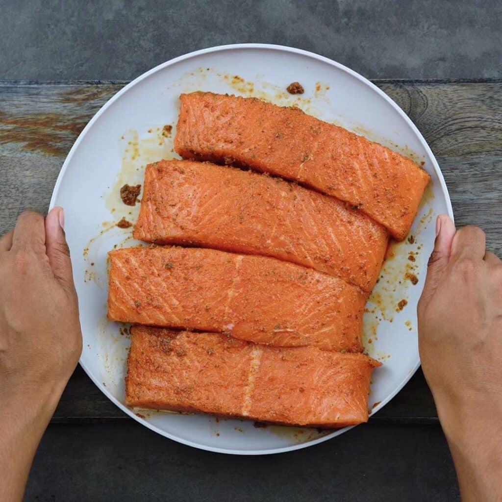 Marinated Salmon fillets in a plate.
