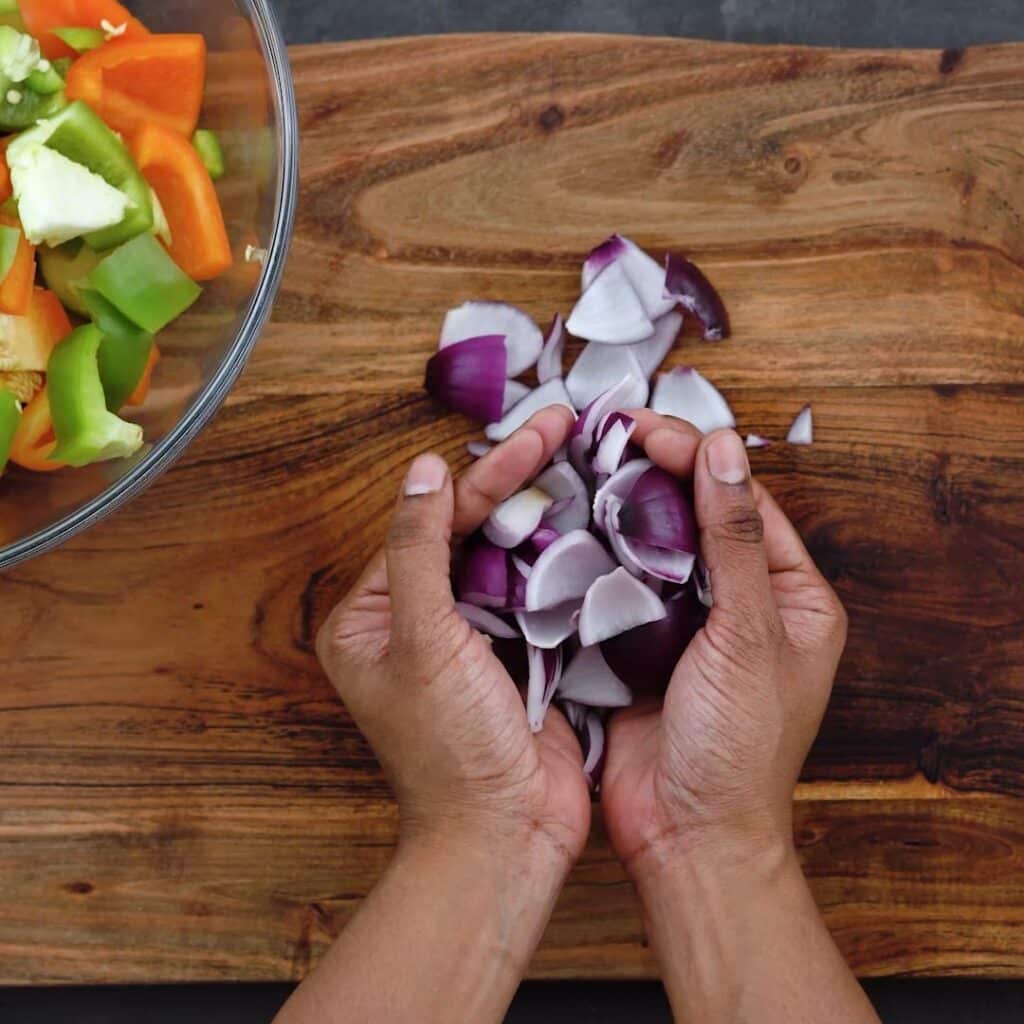 Transferring chopped onions to bowl