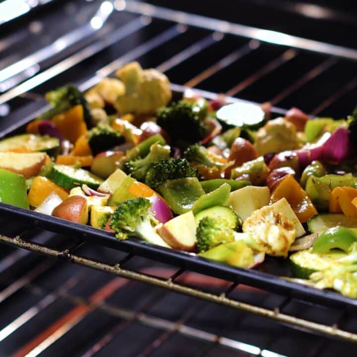 Vegetables in a baking tray inside the oven