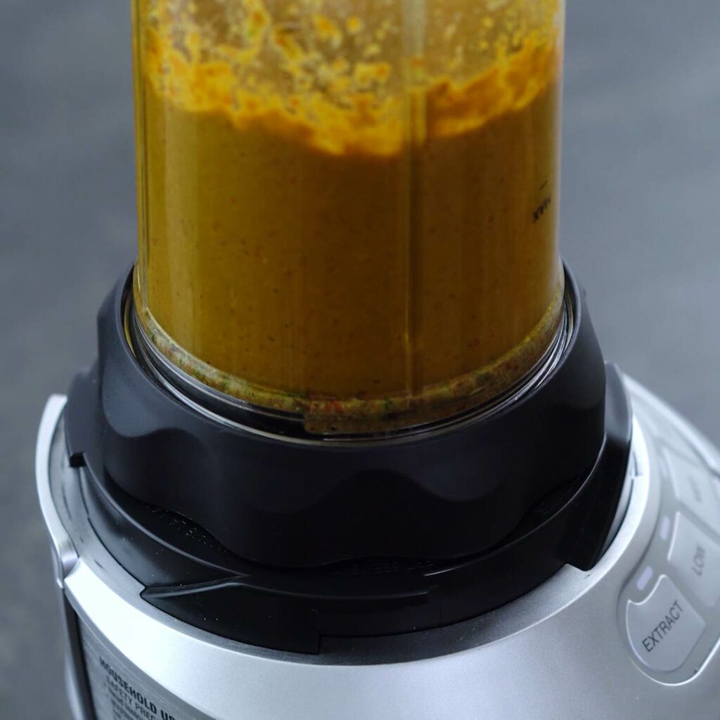 Thai Yellow Curry Paste blending in a jar.