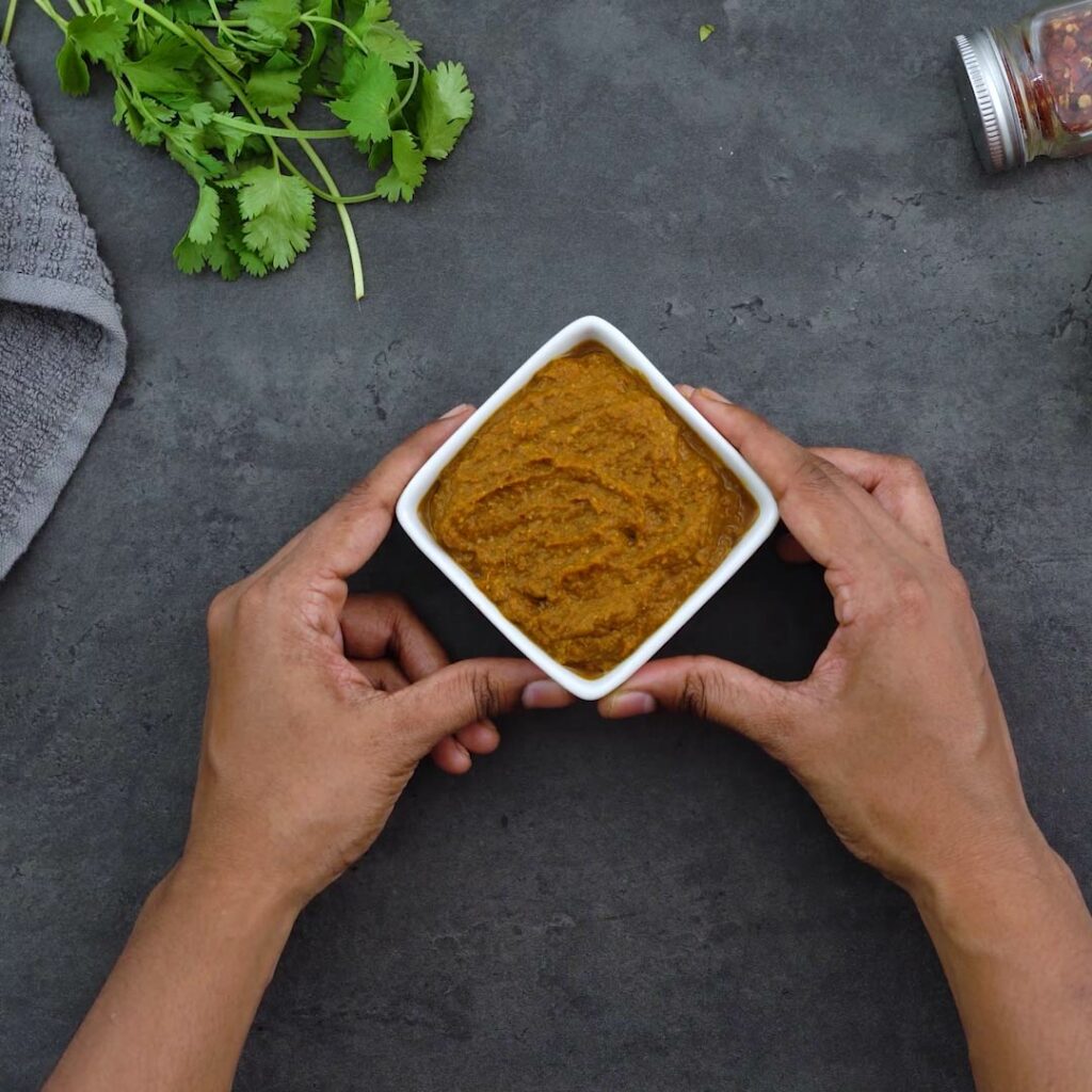 Thai Yellow Curry Paste in a white square bowl.