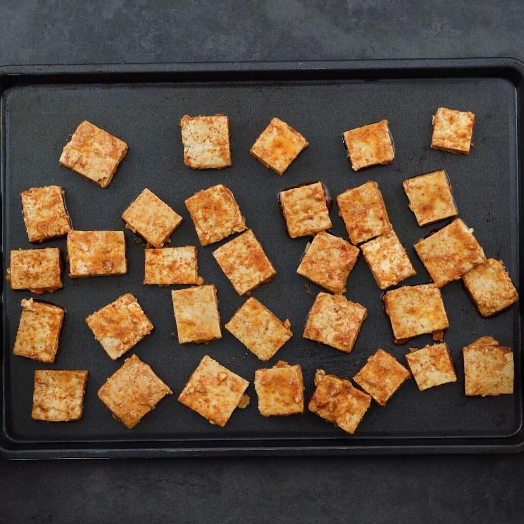 Seasoned Tofu arranged on a baking tray.